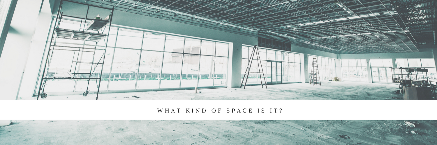 Flooring design ideas from Trinity Surfaces. Empty warehouse with no flooring. 